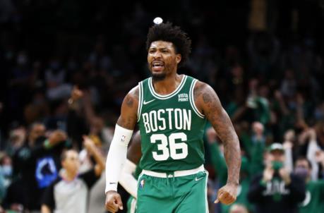 BOSTON, MASSACHUSETTS - JANUARY 02: Marcus Smart #36 of the Boston Celtics reacts after scoring during the fourth quarter of the game against the Orlando Magic at TD Garden on January 02, 2022 in Boston, Massachusetts. (Photo by Omar Rawlings/Getty Images)