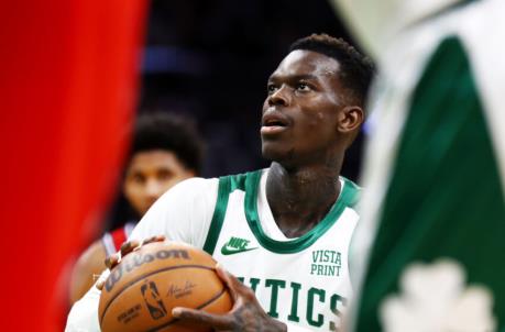 BOSTON, MASSACHUSETTS - DECEMBER 20: Dennis Schroder #71 of the Boston Celtics shoots a free throw during the third quarter of the game against the Philadelphia 76ers at TD Garden on December 20, 2021 in Boston, Massachusetts.NOTE TO USER: User expressly acknowledges and agrees that, by downloading and or using this photograph, User is co<em></em>nsenting to the terms and co<em></em>nditions of the Getty Images License Agreement. (Photo by Omar Rawlings/Getty Images)