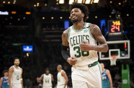 BOSTON, MASSACHUSETTS - FEBRUARY 02: Marcus Smart #36 of the Boston Celtics reacts during a game against the Charlotte Hornets at TD Garden on February 02, 2022 in Boston, Massachusetts. NOTE TO USER: User expressly acknowledges and agrees that, by downloading and or using this photograph, User is co<em></em>nsenting to the terms and co<em></em>nditions of the Getty Images License Agreement. (Photo by Maddie Malhotra/Getty Images)