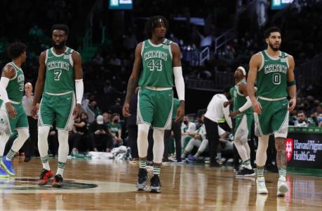 Jan 31, 2022; Boston, Massachusetts, USA; Boston Celtics guard Jaylen Brown (7), center Robert Williams III (44) and forward Jayson Tatum (0) return to the court after a timeout during the second quarter against the Miami Heat at TD Garden. Mandatory Credit: Winslow Townson-USA TODAY Sports