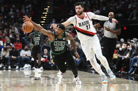 Dec 4, 2021; Portland, Oregon, USA; Boston Celtics guard Marcus Smart (36) steals the ball away from Portland Trail Blazers center Jusuf Nurkic (27) during the first half at Moda Center. Mandatory Credit: Troy Wayrynen-USA TODAY Sports